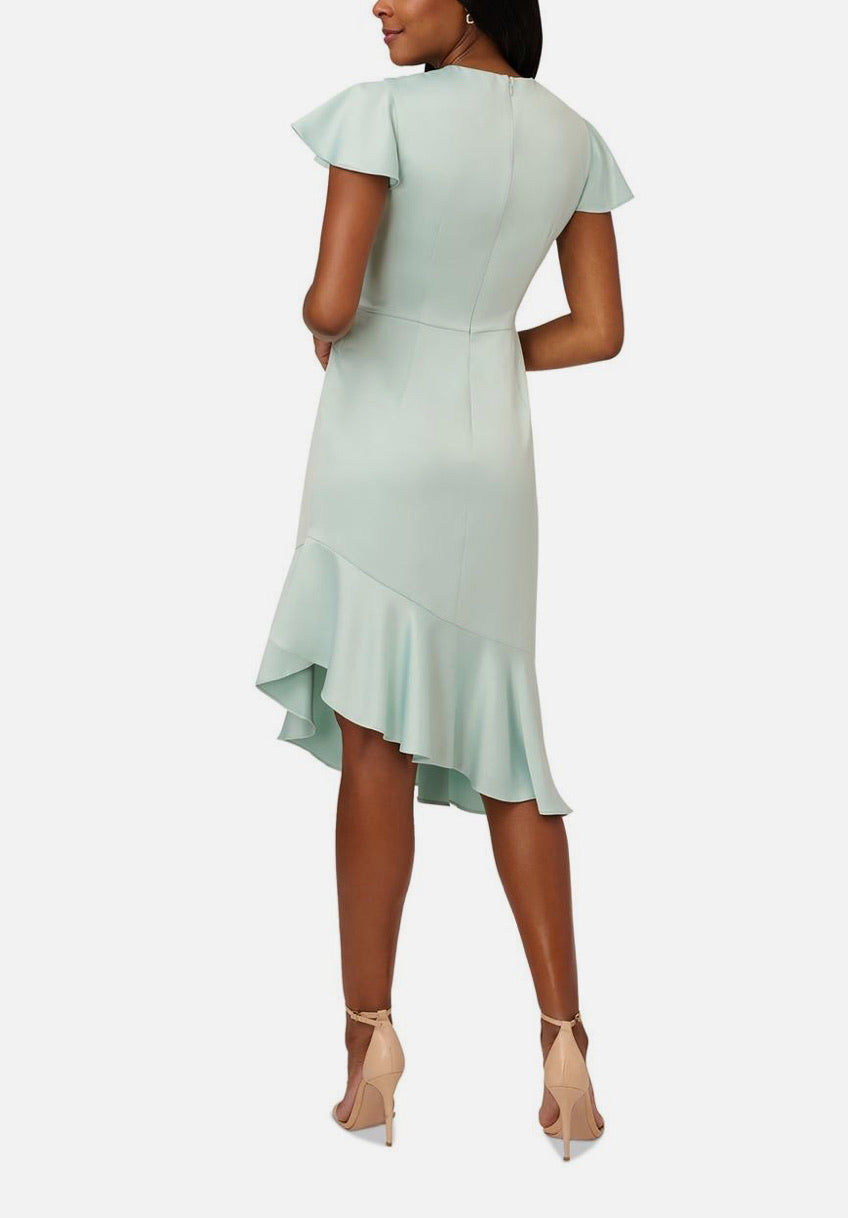 Light green dress with ruffled sleeves on a white background