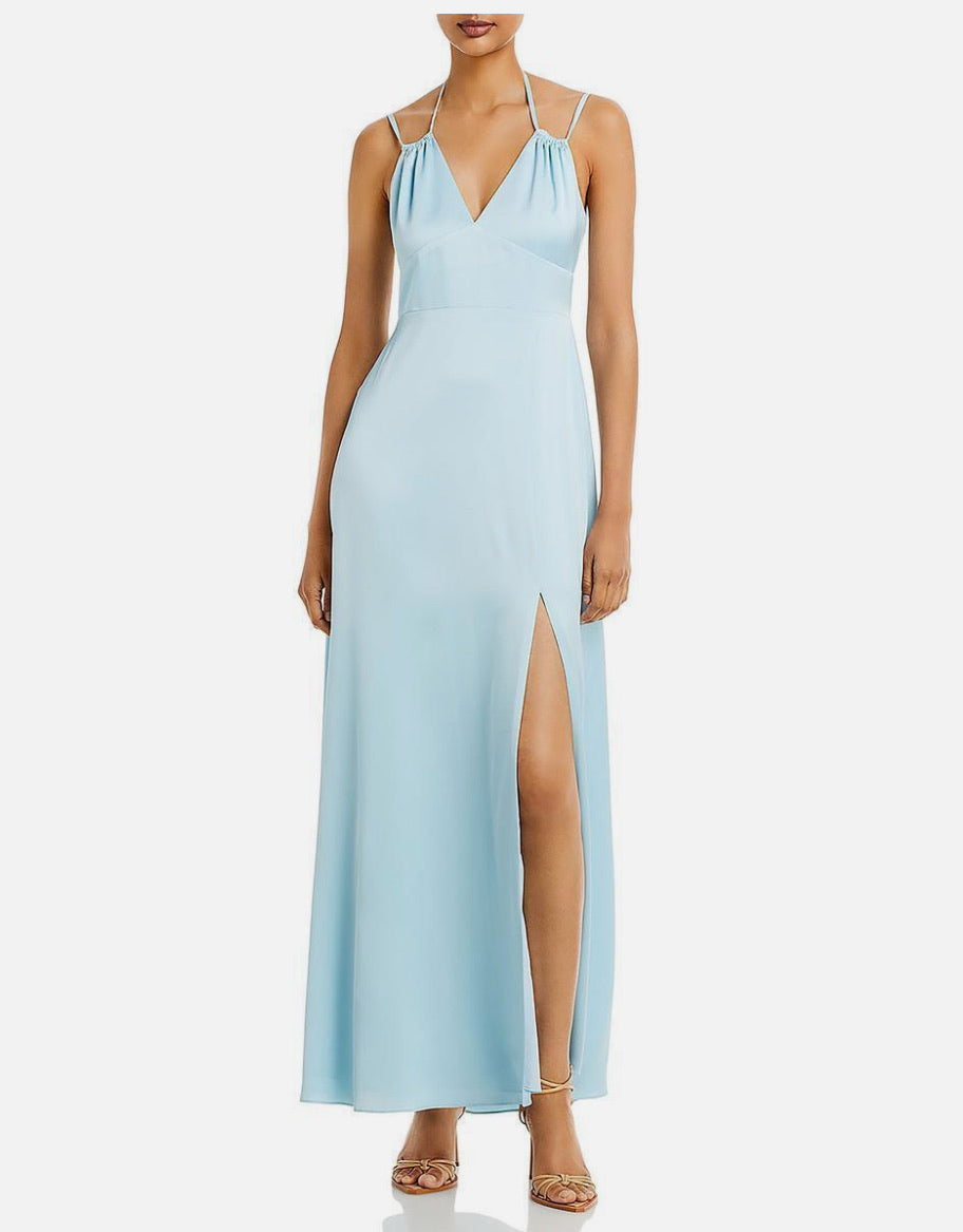 Light blue evening gown with a slit on a white background
