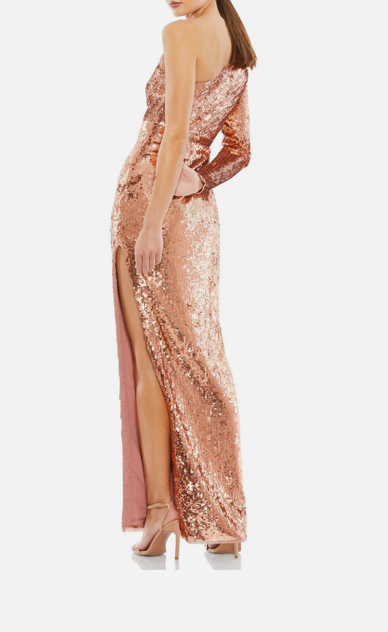 Rose gold sequin gown with a high slit on a white background