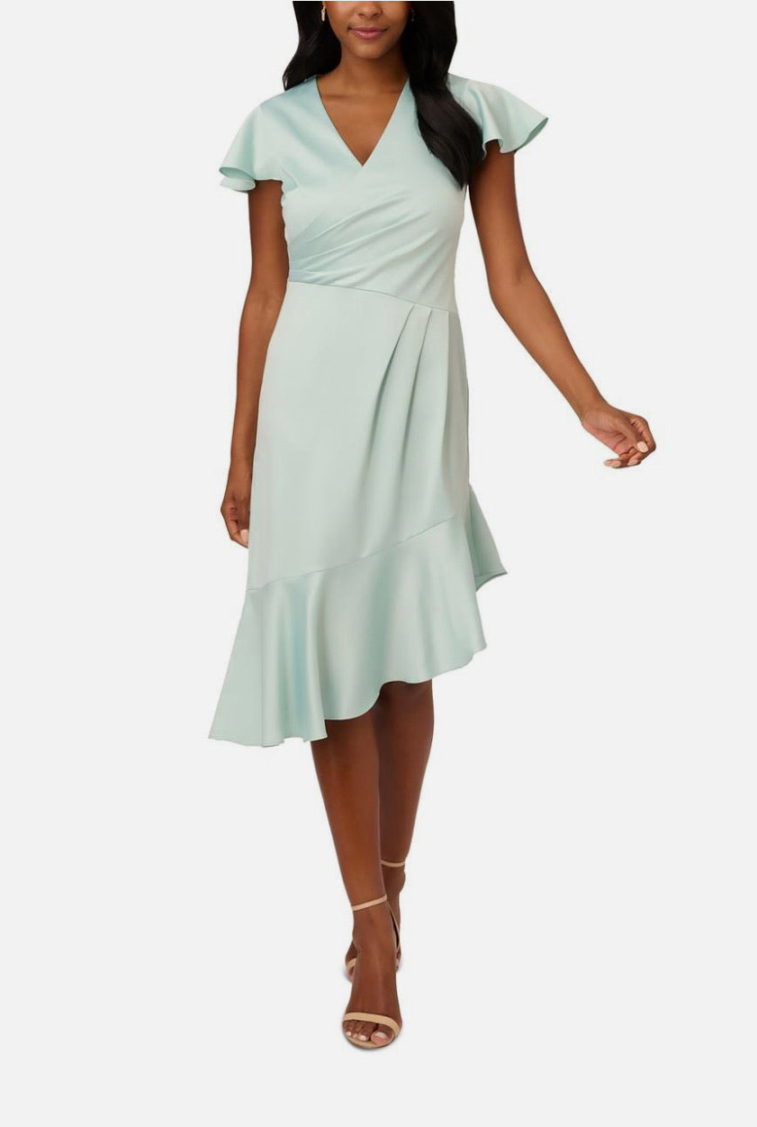 Light blue dress worn by a model on a white background