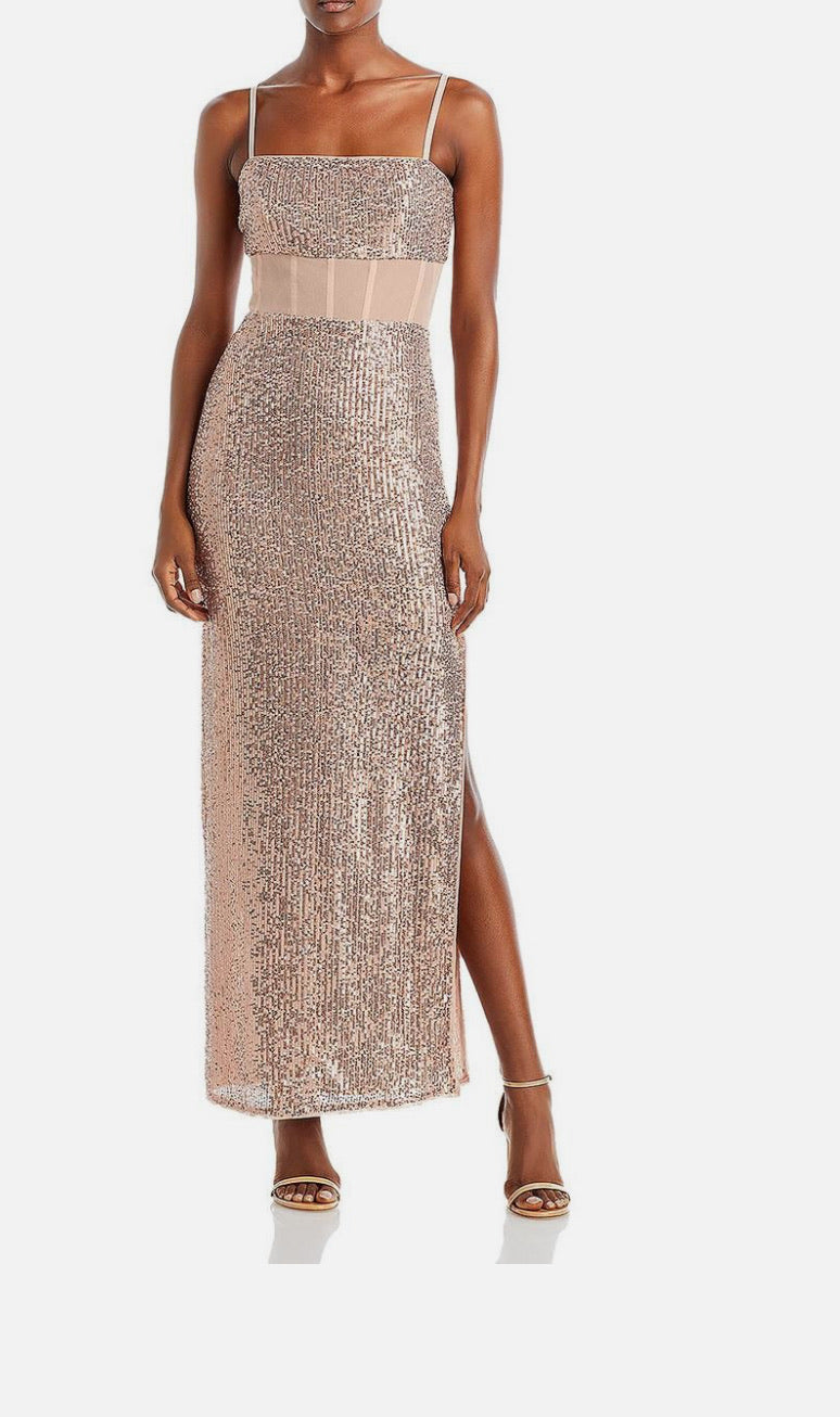Woman wearing a sparkly dress with a white background
