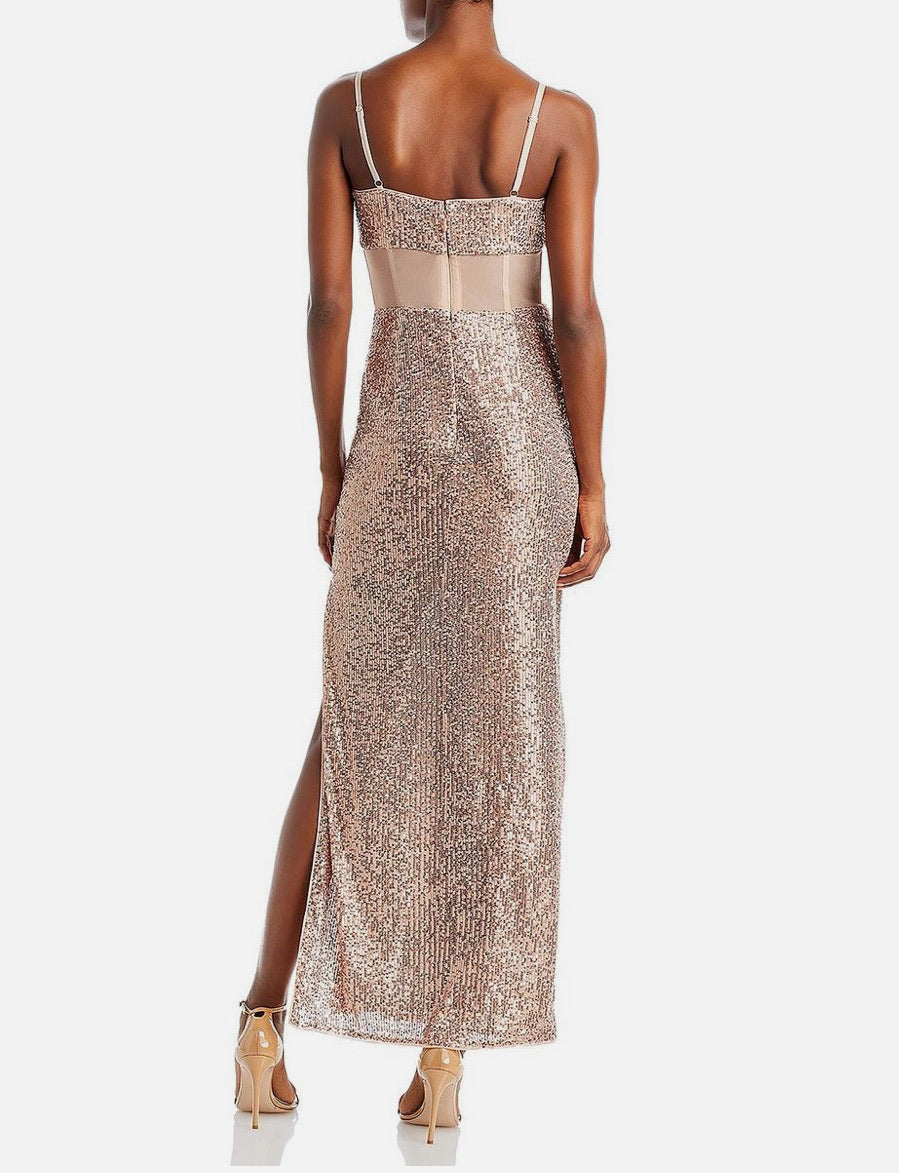 Woman wearing a sparkly evening gown with a white background