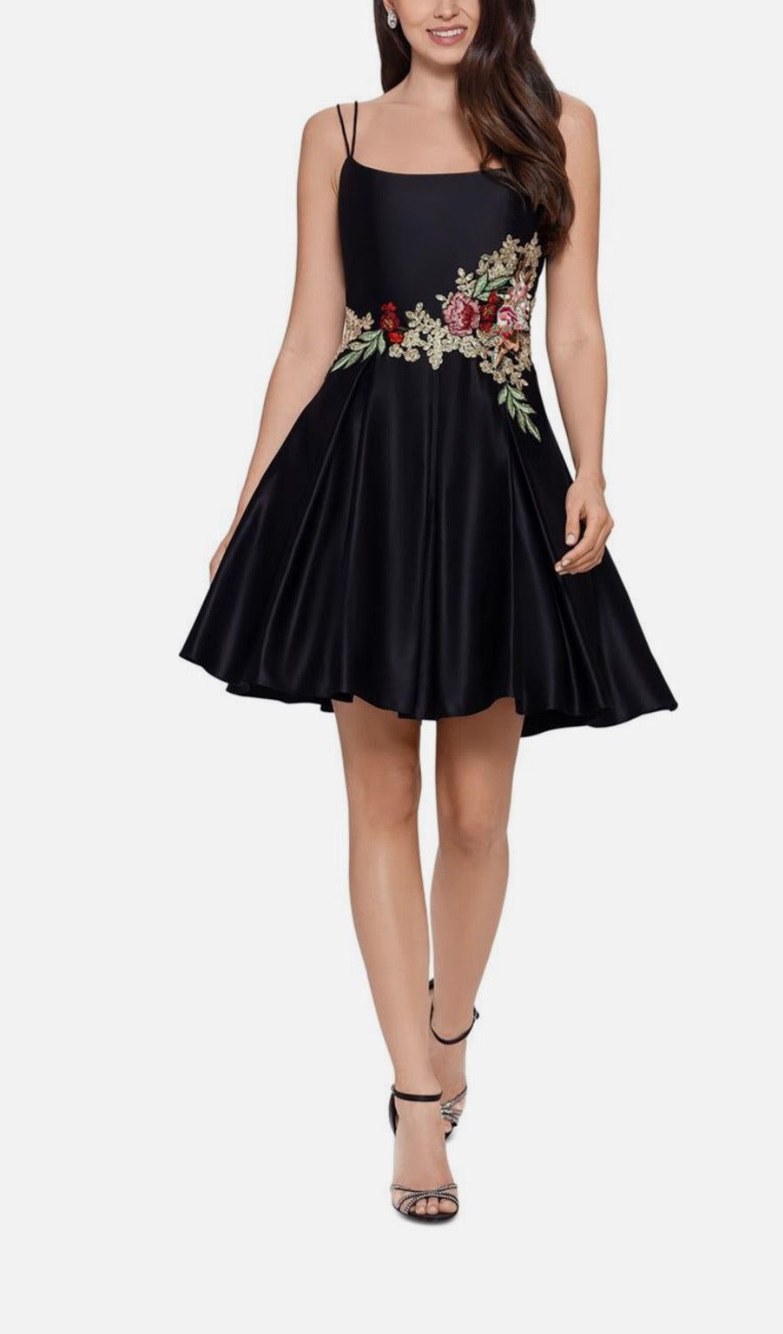 Black dress with floral embroidery on a white background