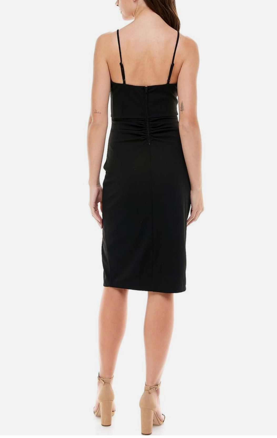 Black dress worn by a person on a white background