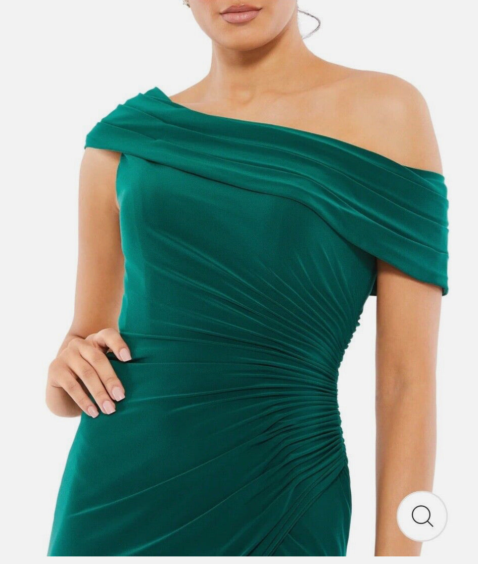 Green off-shoulder dress on a model against a white background