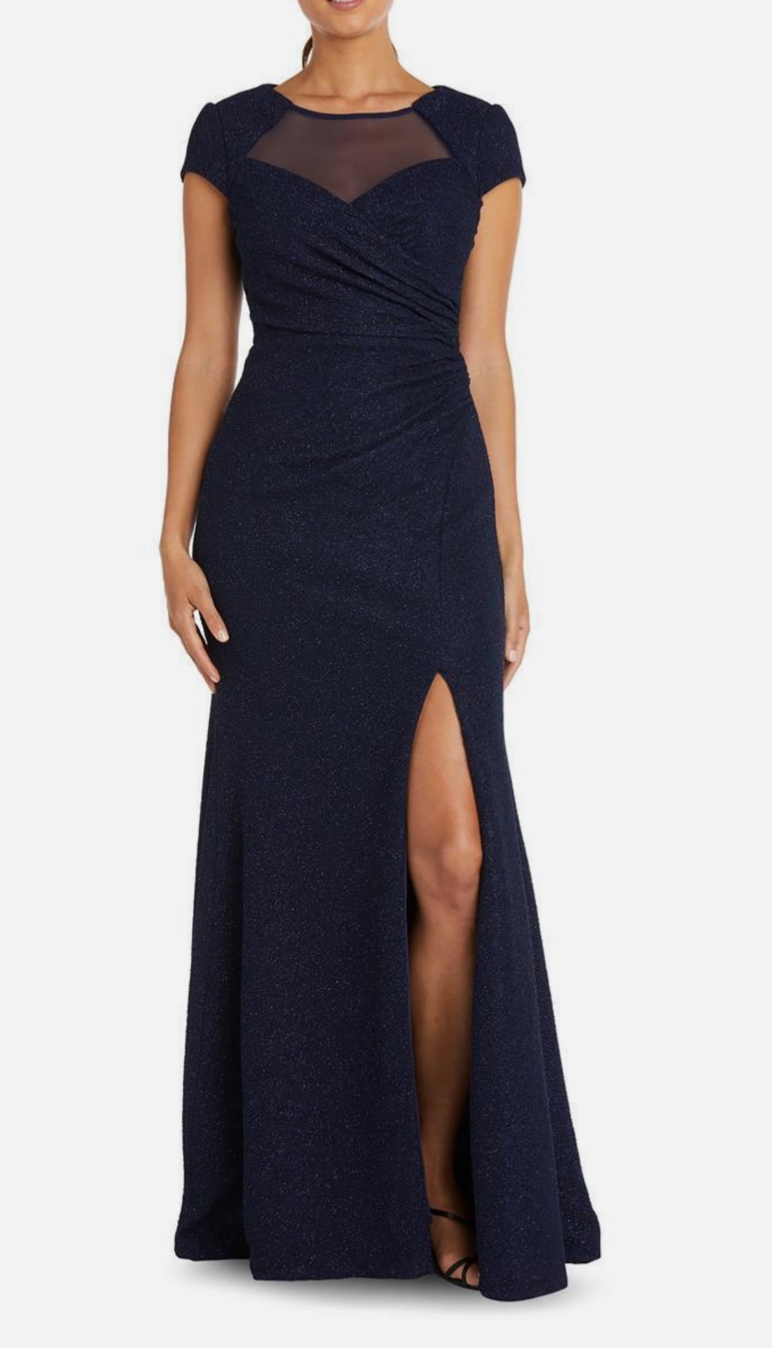 Navy blue evening gown with a high slit on a white background