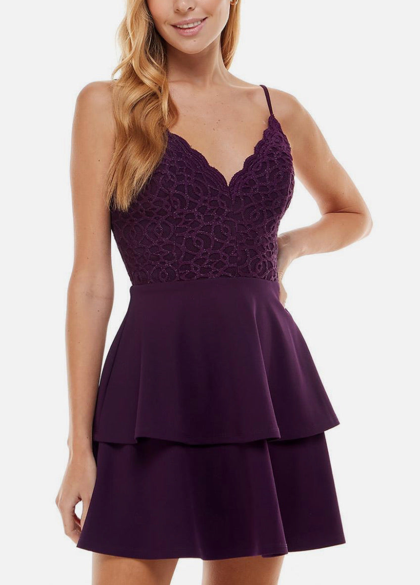 Purple dress with lace detailing on a white background