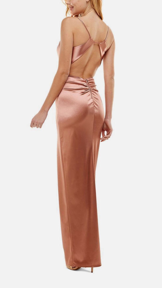 Rose gold evening gown with open back on a white background