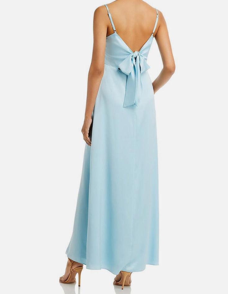 Light blue dress with a bow detail on a white background