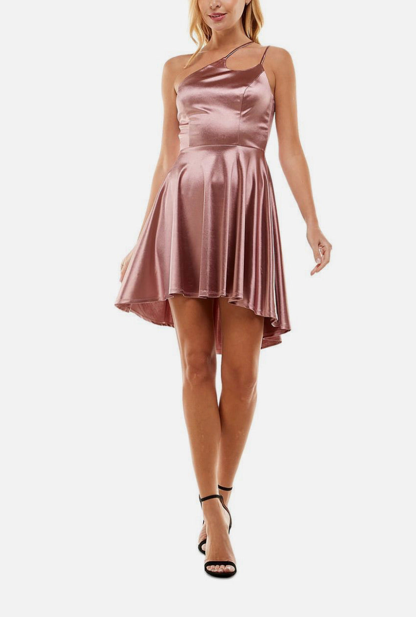 Woman wearing a pink satin dress on a white background