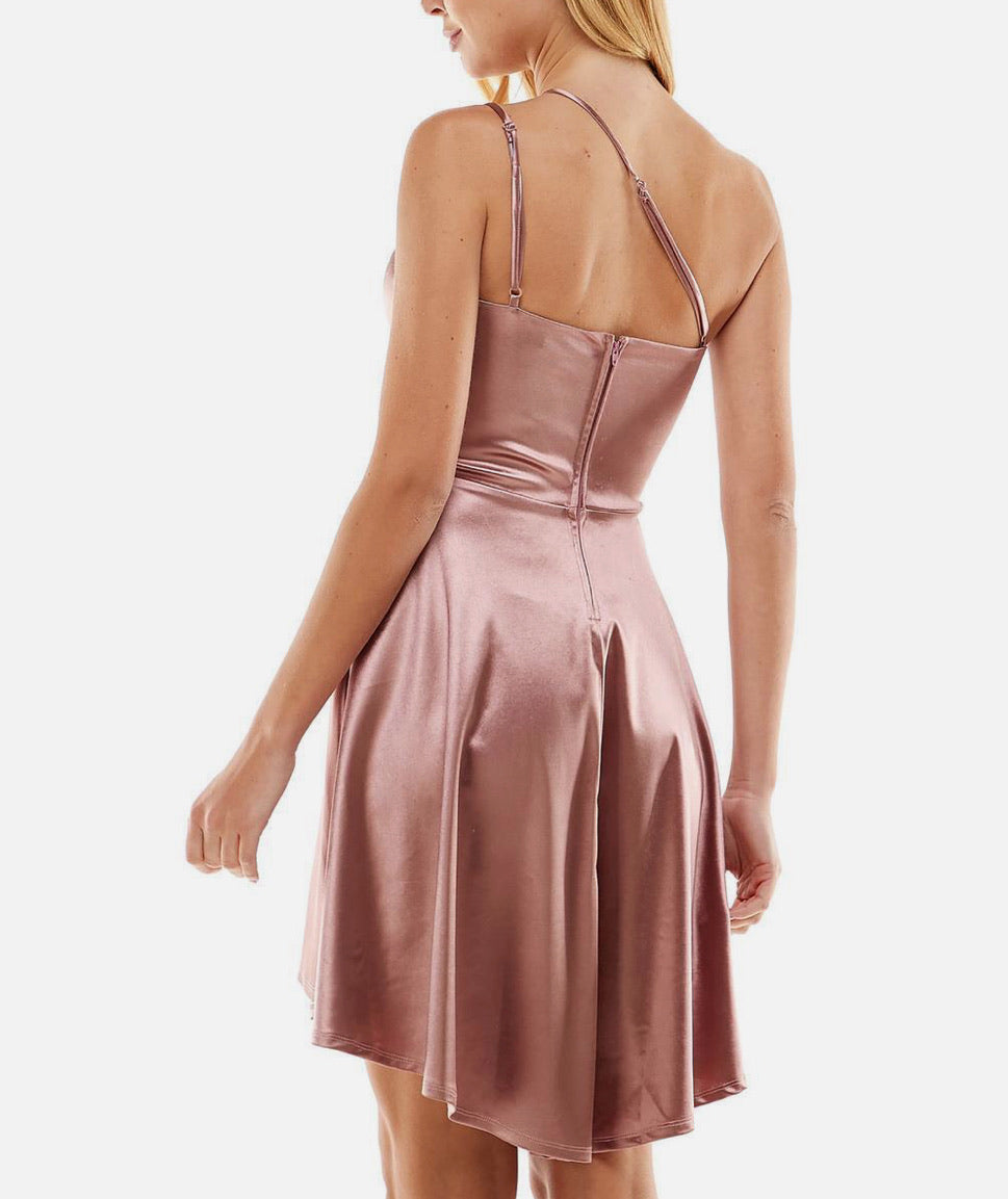 Pink satin dress with thin straps on a white background