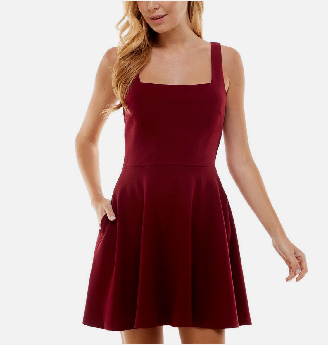Red dress worn by a model on a white background