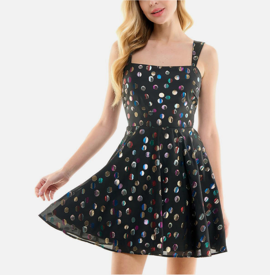 Black dress with colorful polka dot pattern on a white background