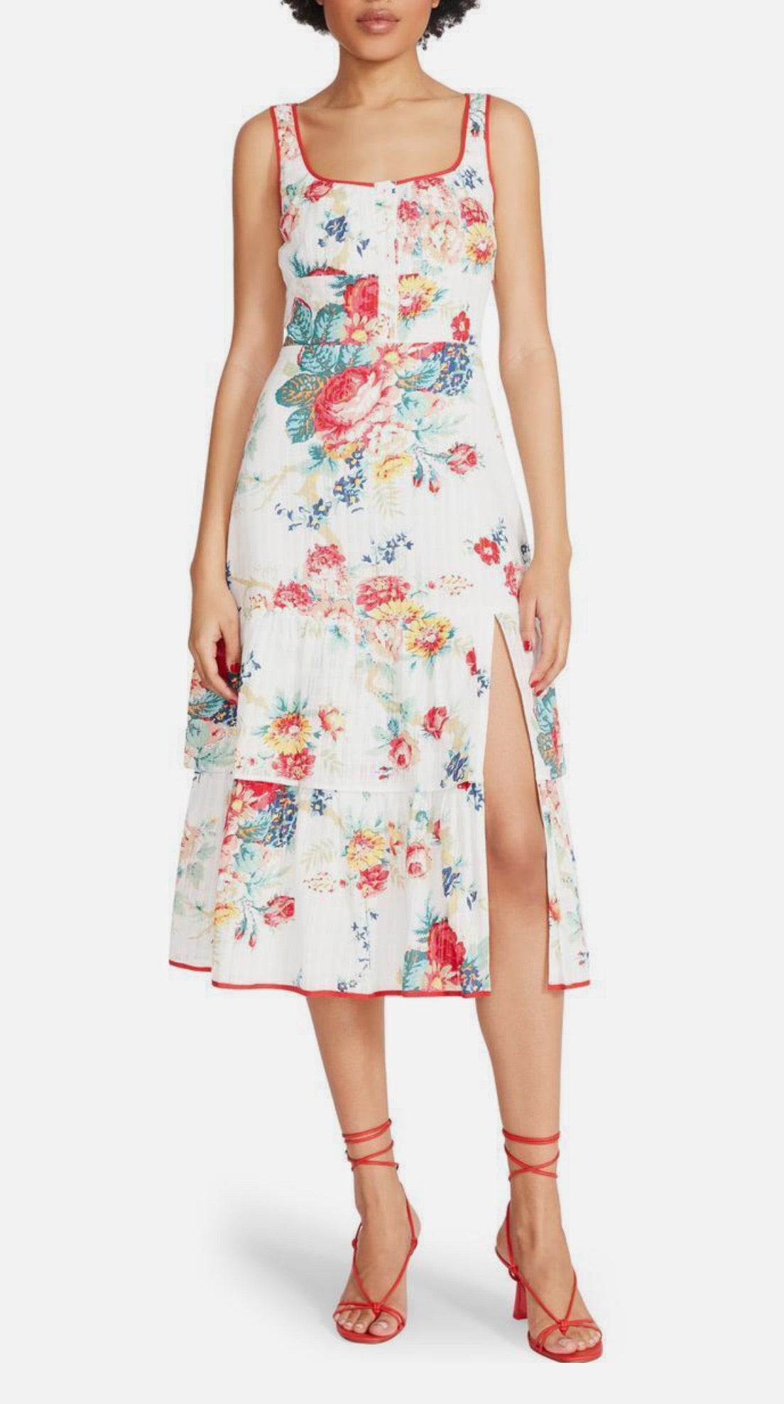 Woman wearing a floral dress with a white background