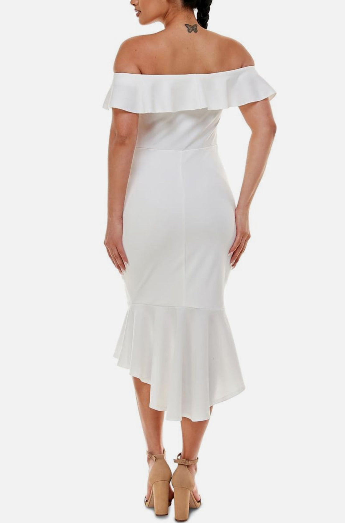 White off-shoulder dress with ruffled details on a white background